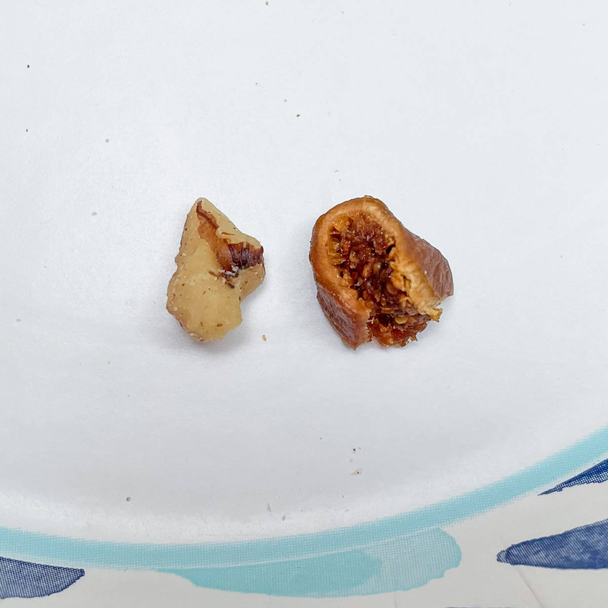 Showing the size of the chopped walnuts and the chopped figs. You want about the same size for both.