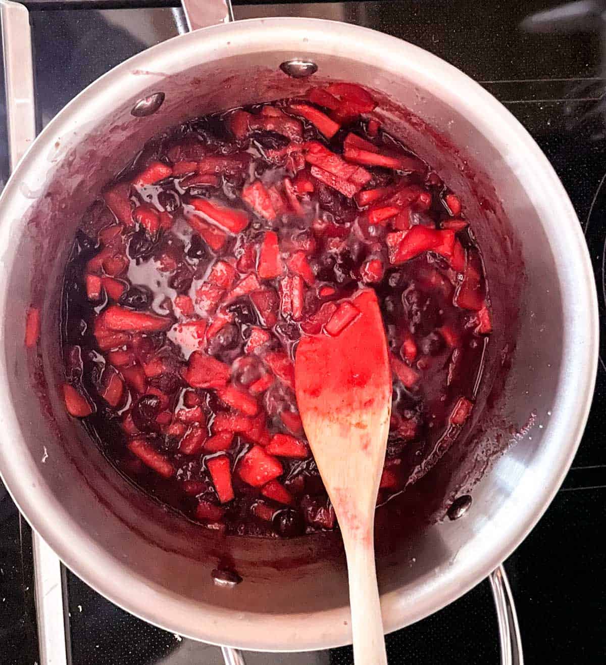 Cranberries bursting from heat of the juices and pan.