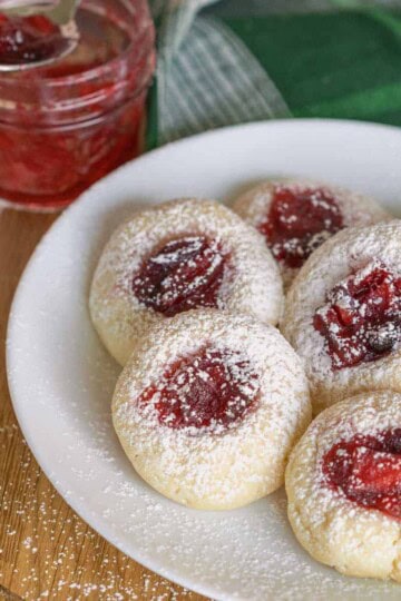 Apple Cranberry Homemade Jam Cookies with a jam jar.