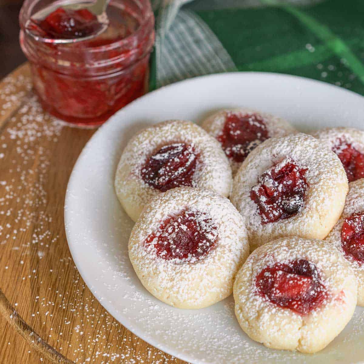 Apple Cranberry Homemade Jam Cookies with a jam jar.