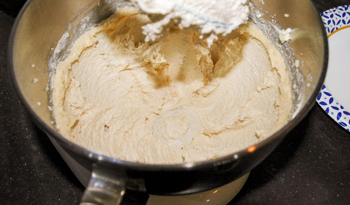 Fluffy butter and white and brown sugars beaten in a mixer bowl.