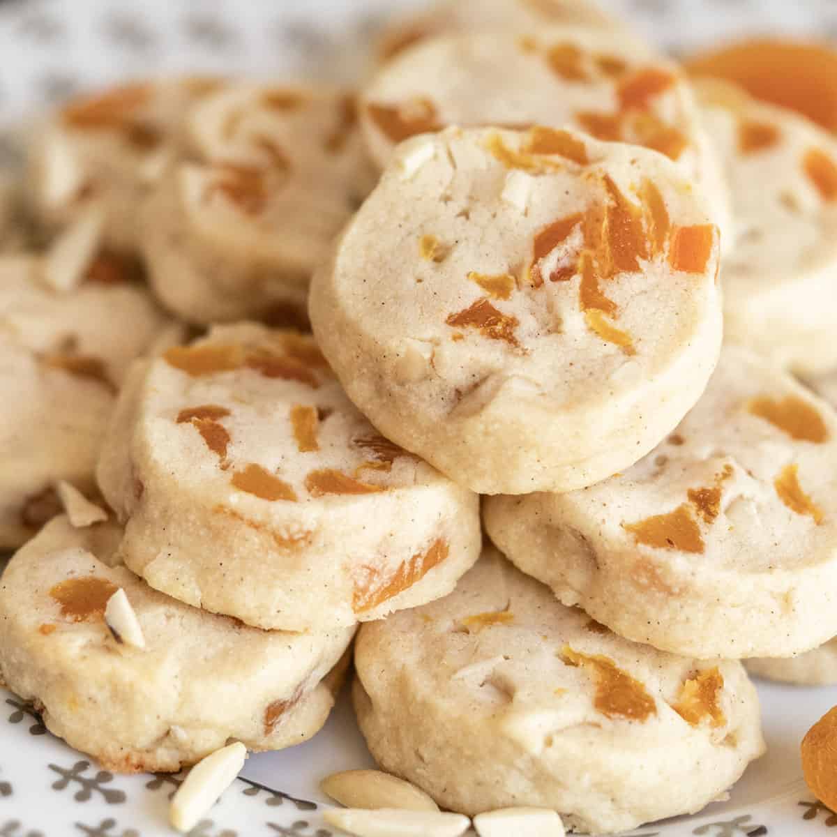 Apricot with vanilla bean cookies on a white plate.