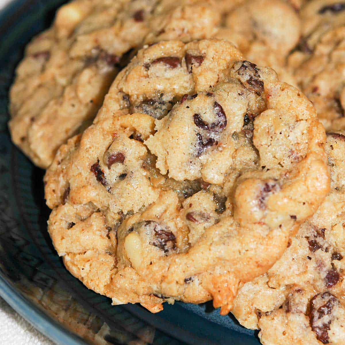 Everything in the bowl finished cookies on a blue plate.