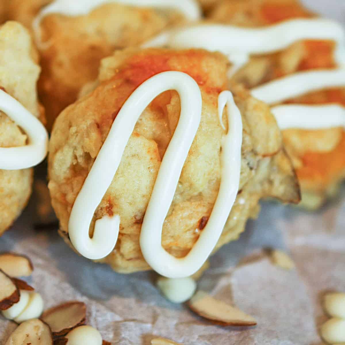 Fresh Apricot and Almond cookies with icing swirled on top.