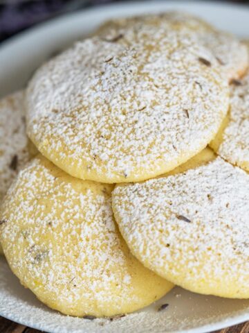 Lemon with Lavender and Honey Cookies on white dish.