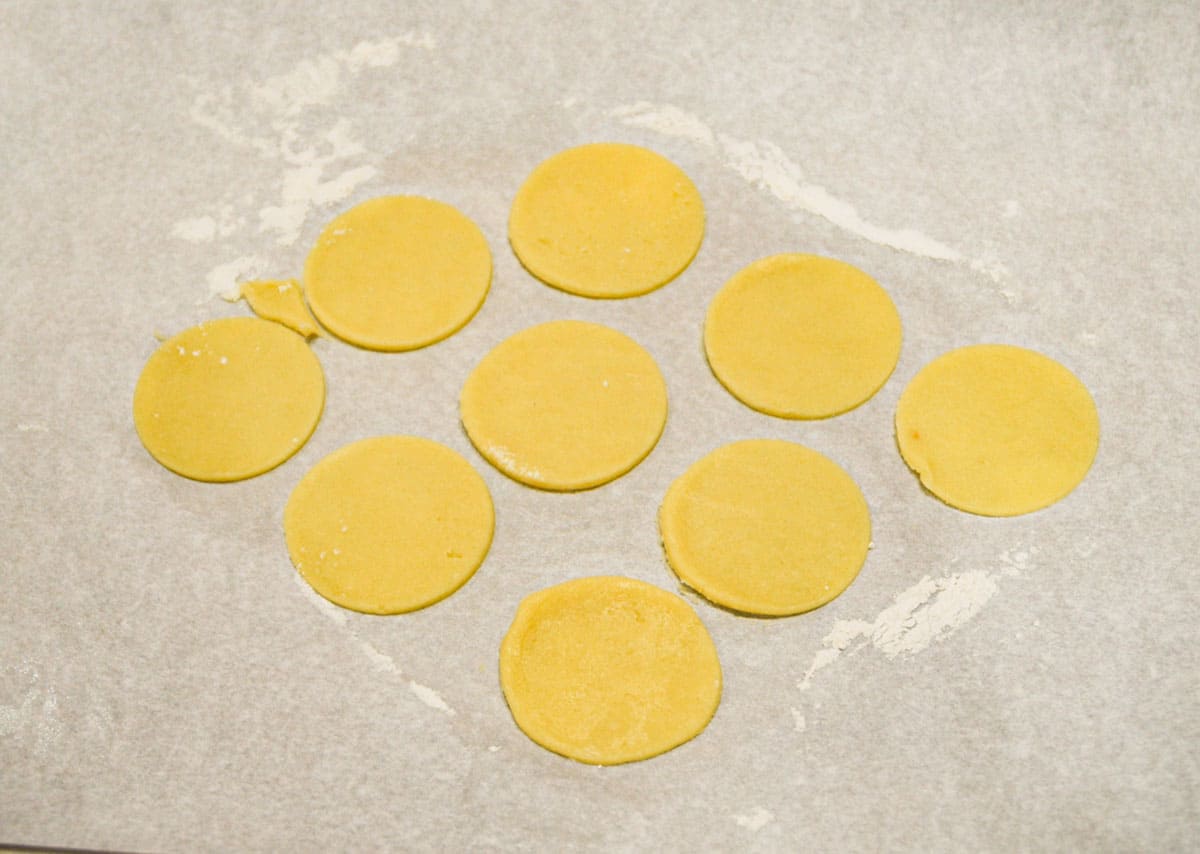 PA Dutch Sand Tart rolled out cookie dough cut out in circles.
