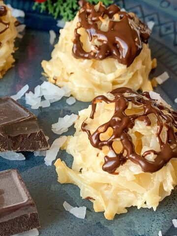 Finished coconut macaroons with the chocolate drizzle on top of each cookie.