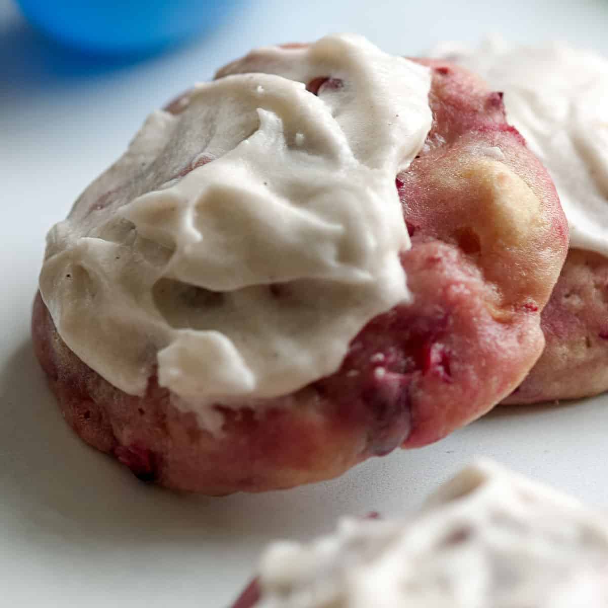 Fresh apple and cranberry cookie with icing.