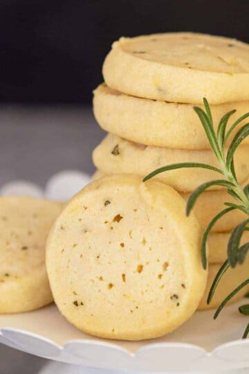 Rosemary lemon with honey cookies on white dish.