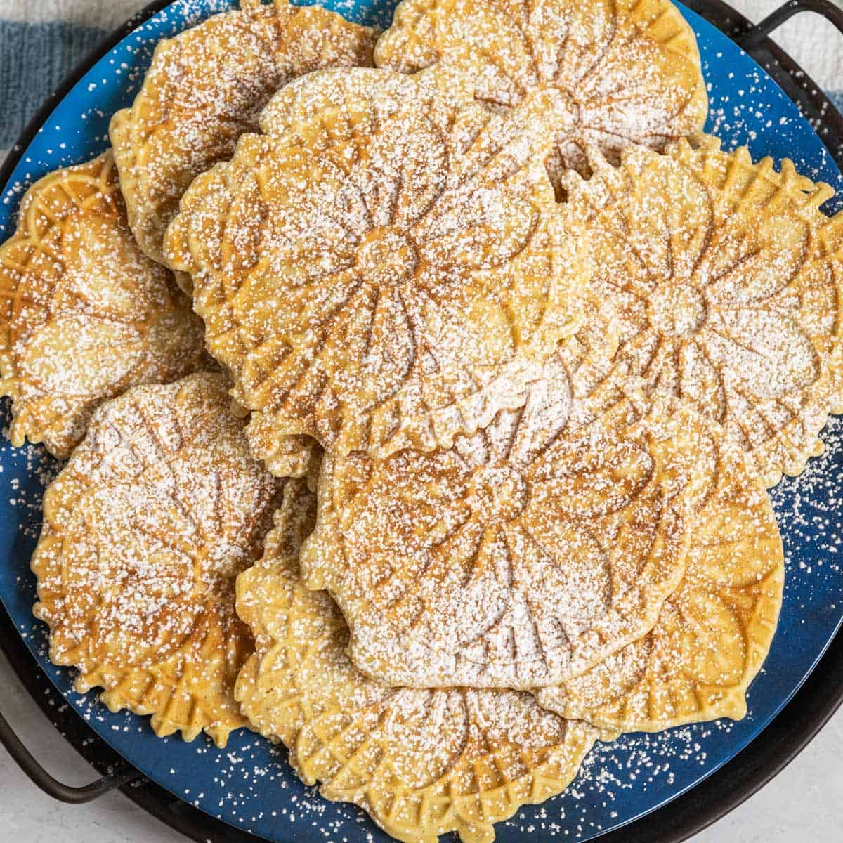 A plateful of cardamon orange with cinnamon pizzelle. 