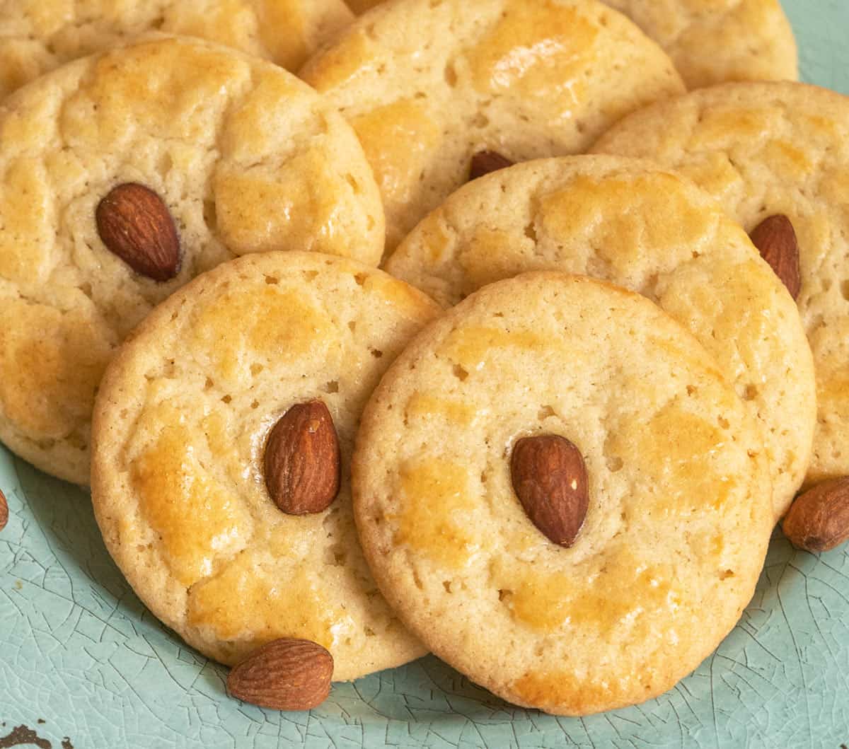 Chinese Almond Cookies close up on a green plate.