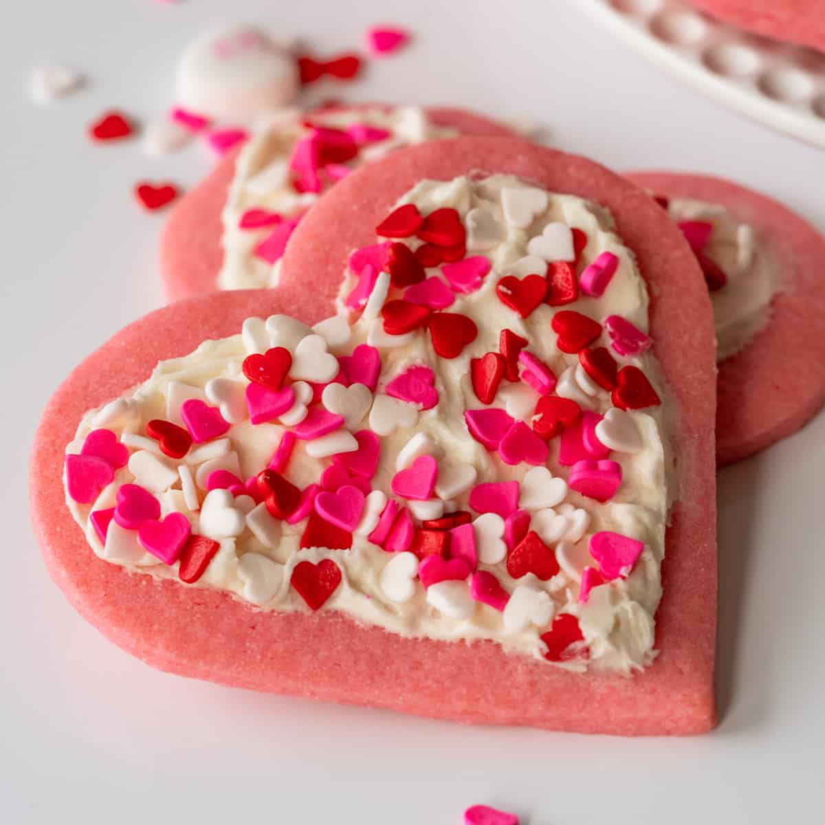 Close-up of a finished heart sugar cookies with buttercream icing.