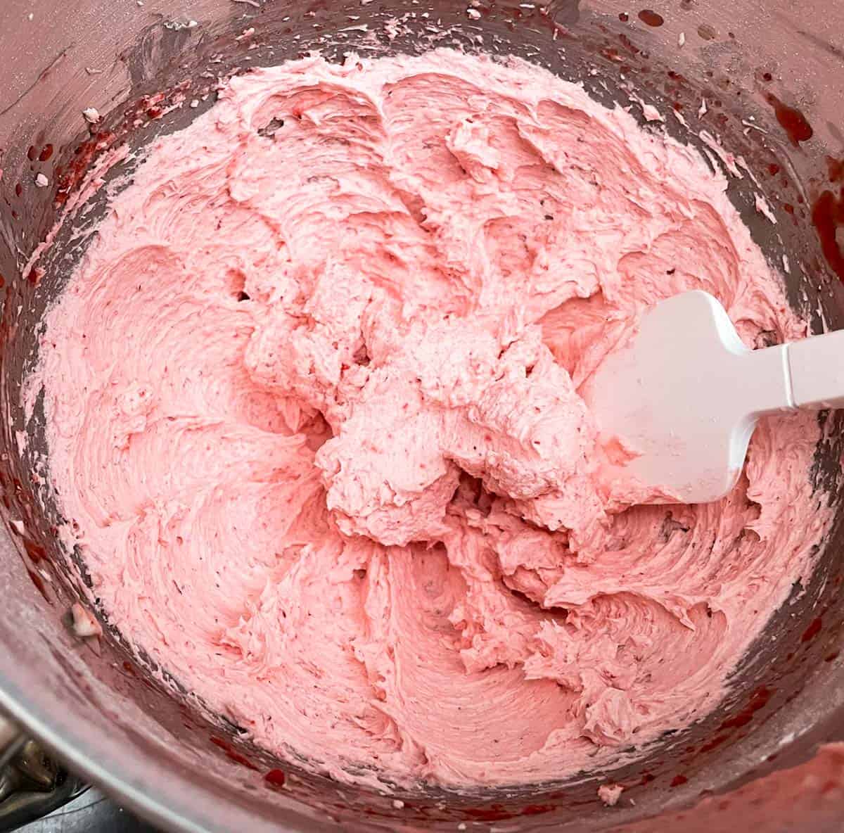 Strawberry icing in the mixer bowl.