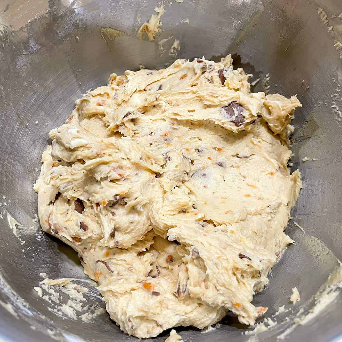 Light colored cookie dough after Butterfinger bits is added at the end of mixing.