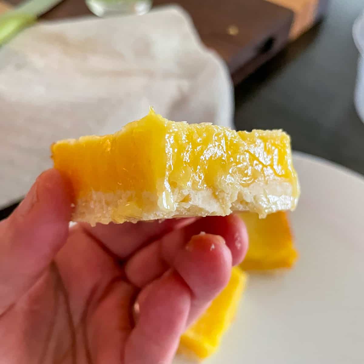 Side view of a lemon bar in my hand.