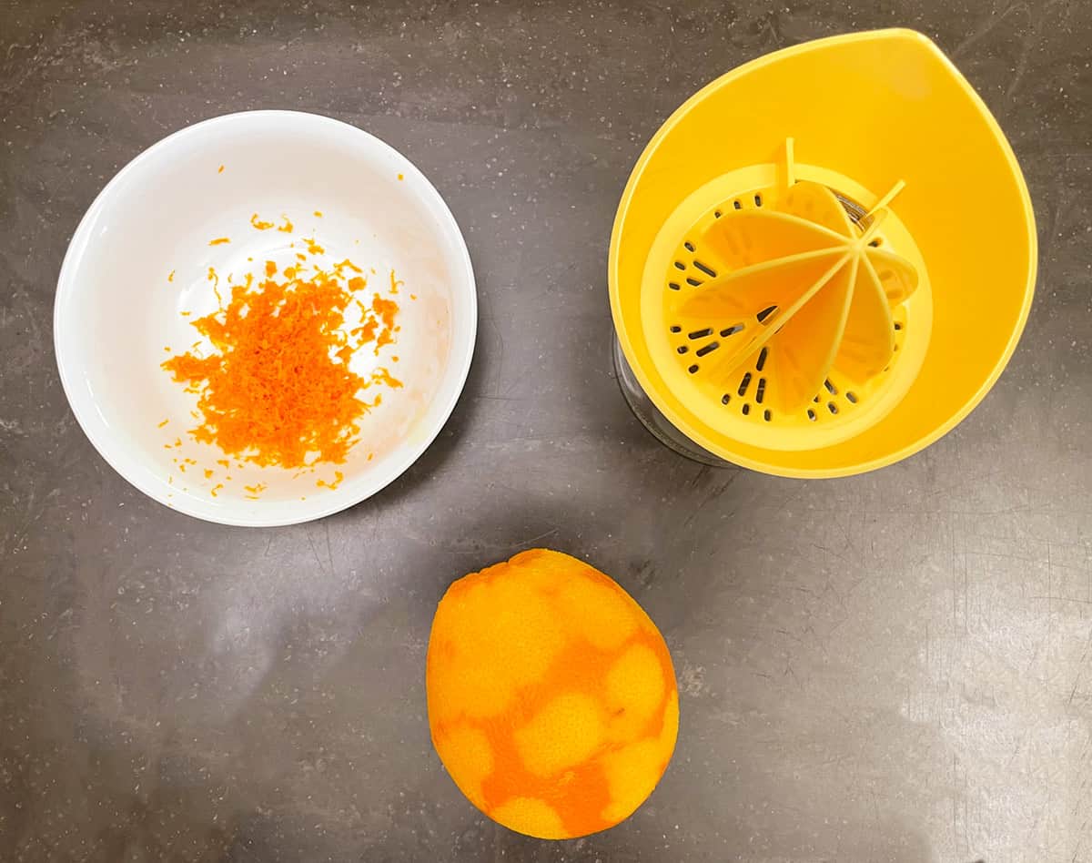 Zesting and juicing an orange.