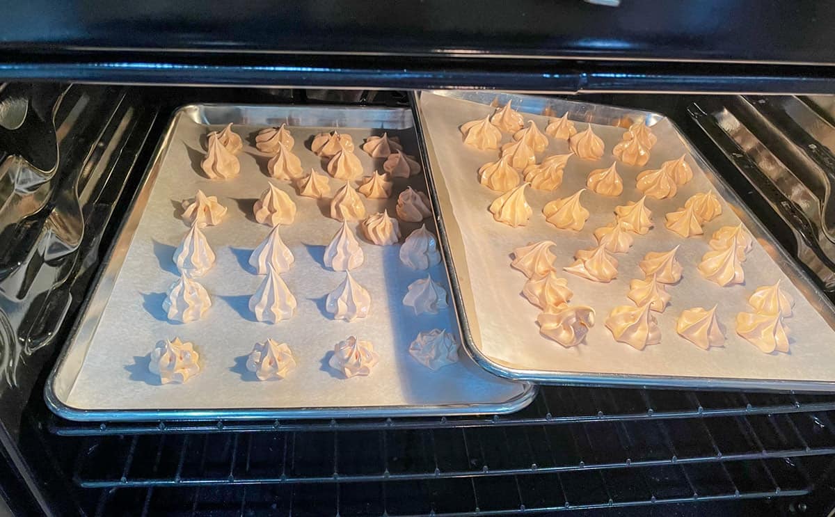 Orange meringue cookies in the oven.