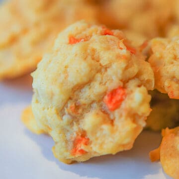 Baked Papaya Coconut and Macadamia nut cookies in a pile.