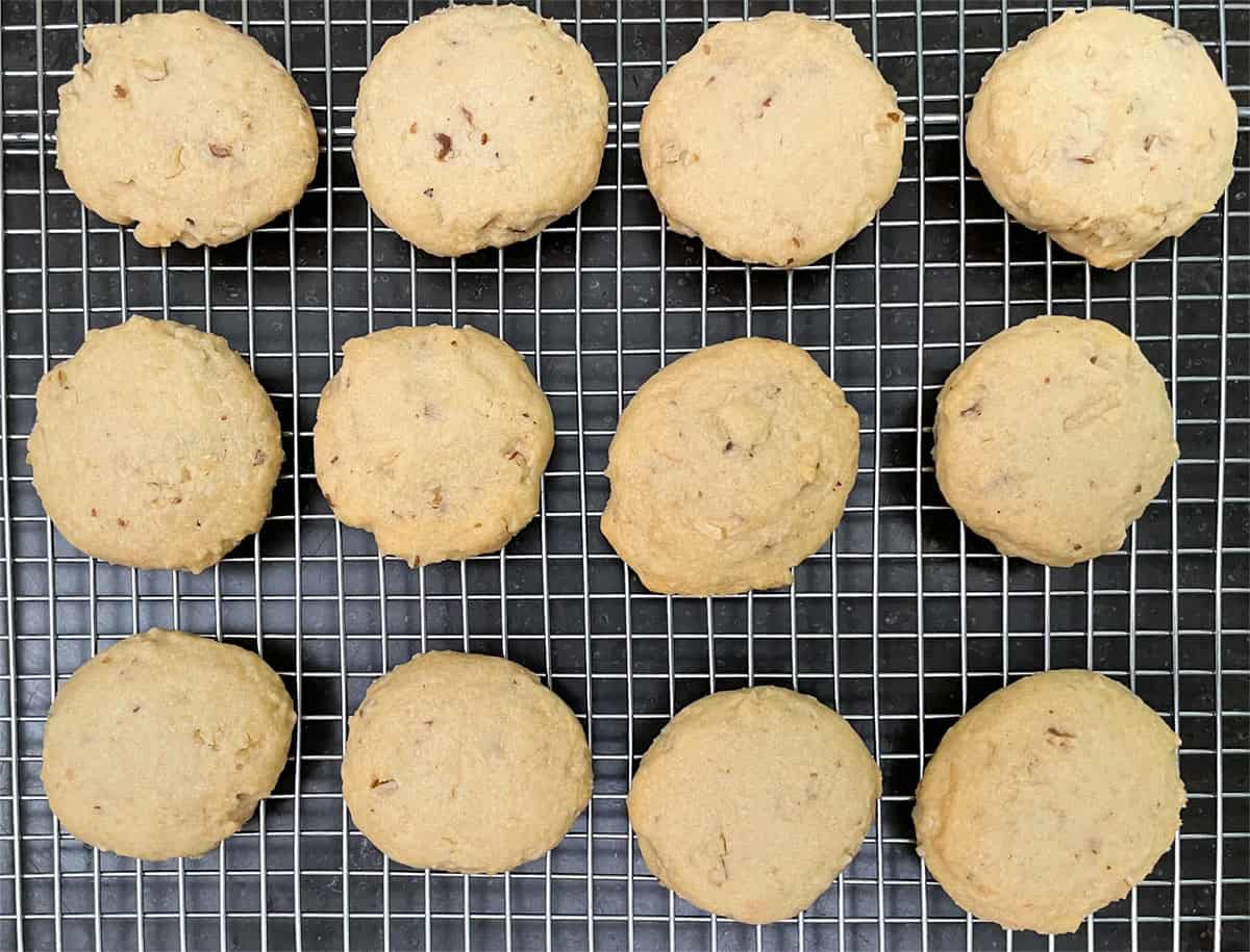 Black walnut maple cookies cooling on a wire rack.