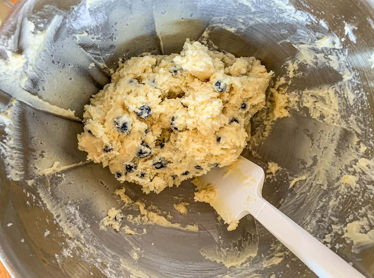 Blueberry lemon cookie dough with all ingredients in a mixer bowl.