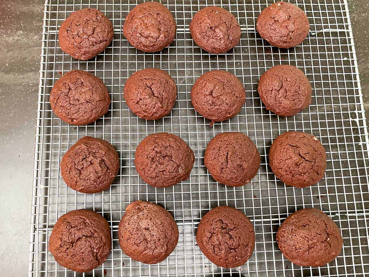 Chocolate cream cheese cookies cooling on a wire rack.