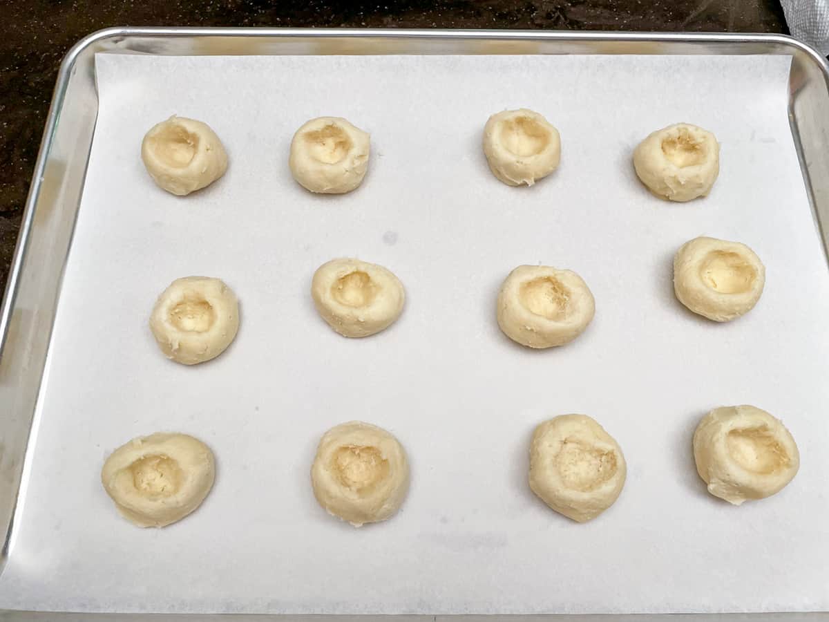 Size of the wells in the thumbprint cookies before adding the filling.