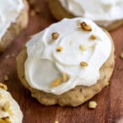 Banana Cookie with frosting and walnuts on top.