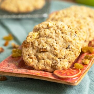 Apple Raisin Walnut Oatmeal Cookies on a red dish.