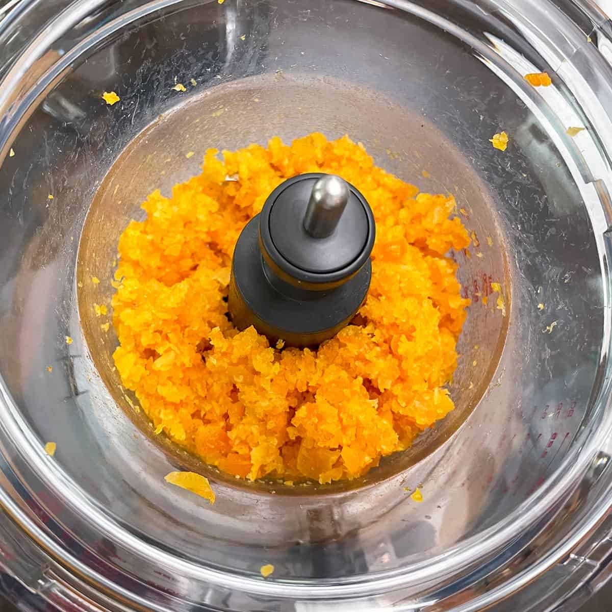 Dried apricots in a food processor after being diced.
