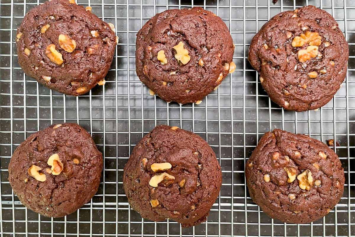 Chocolate Cookies with Orange and Toffee Bits out of the oven and cooling on a wire rack.