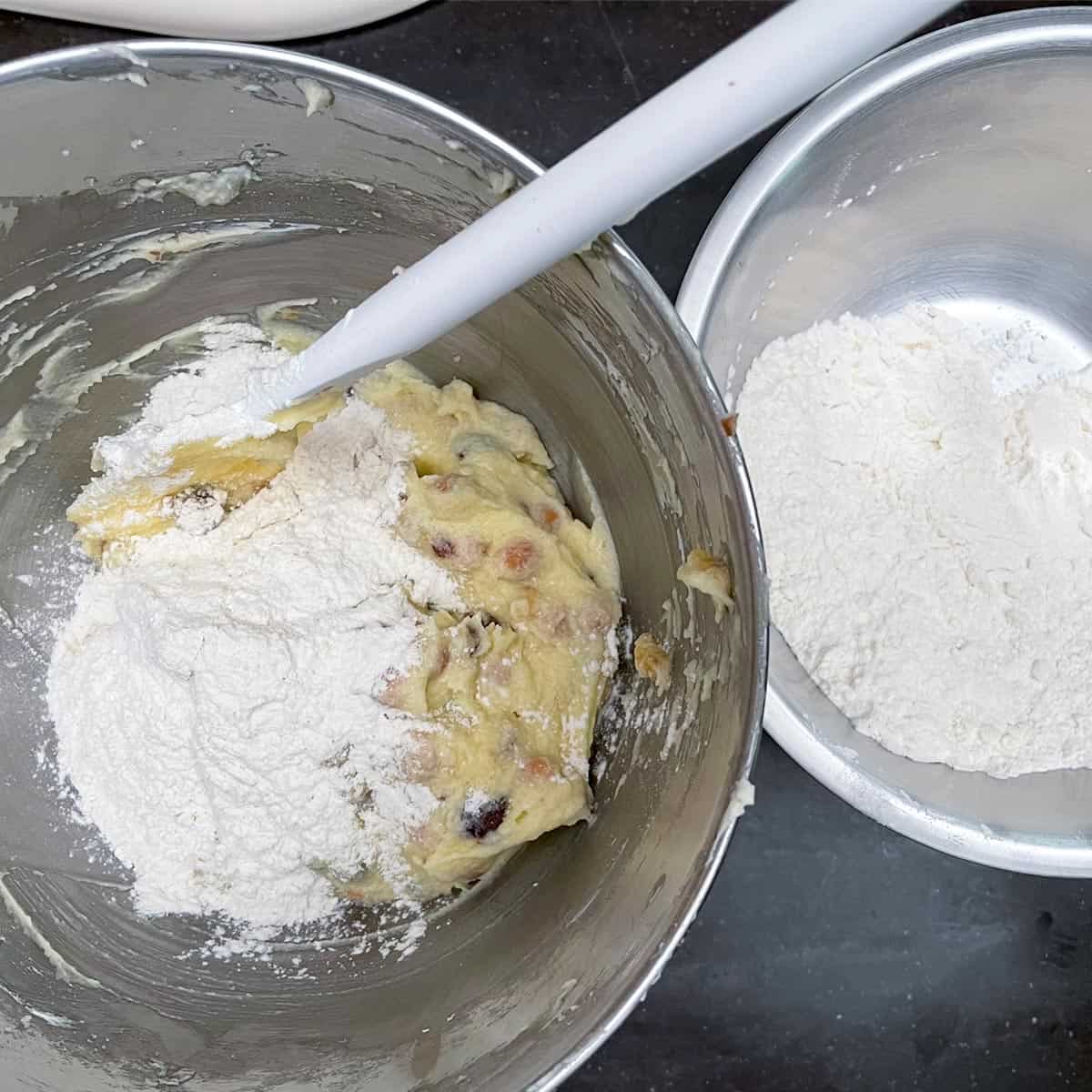 Folding in flour mixture into the cookie dough.