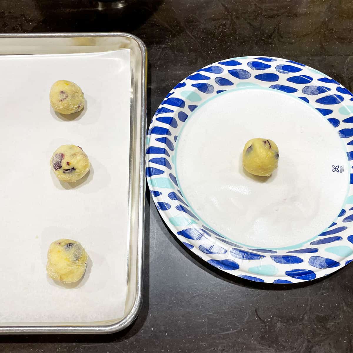 Plate with super fine sugar so you can roll cookie dough balls before baking.