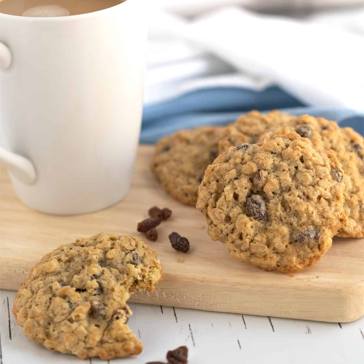 Spiced Oatmeal Raisin Cookies with a cup of coffee.