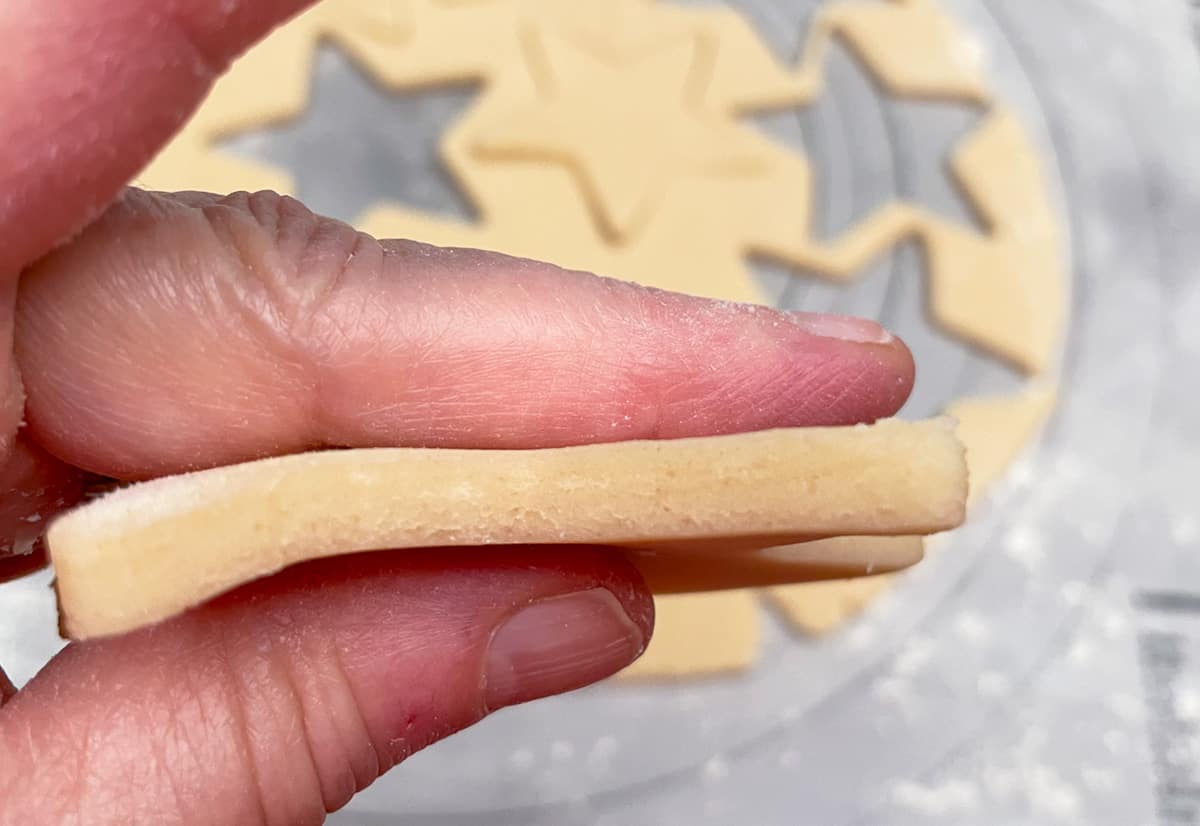 Cut out star shaped sugar cookie showing ¼" thick.