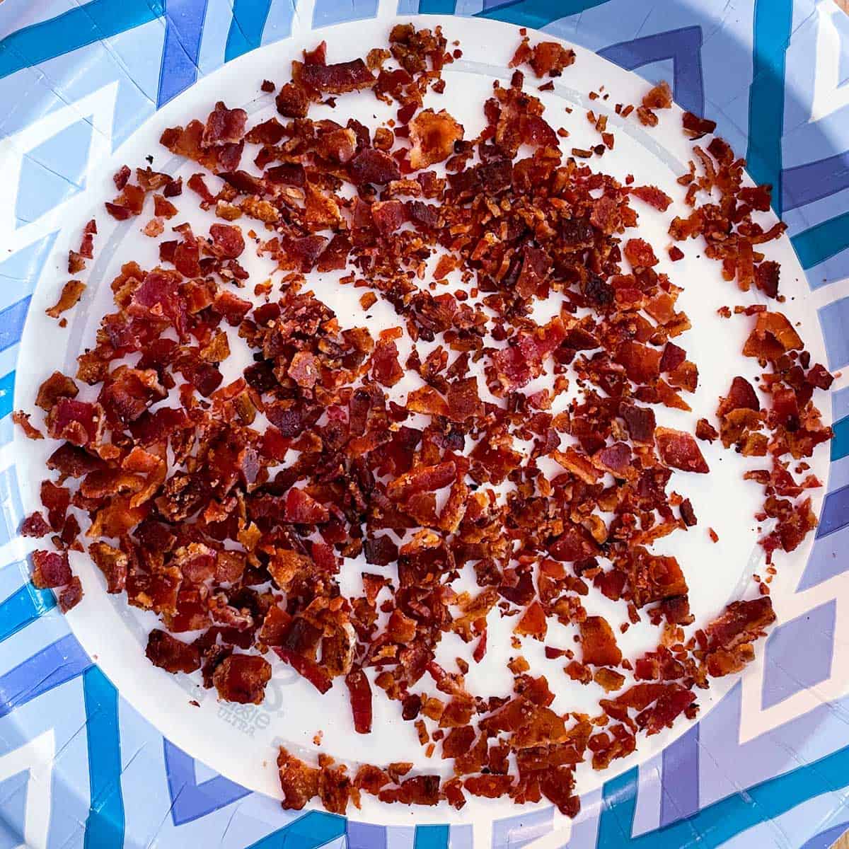 Bacon cooked and crumbled into small pieces for bourbon maple syrup with bacon cookies