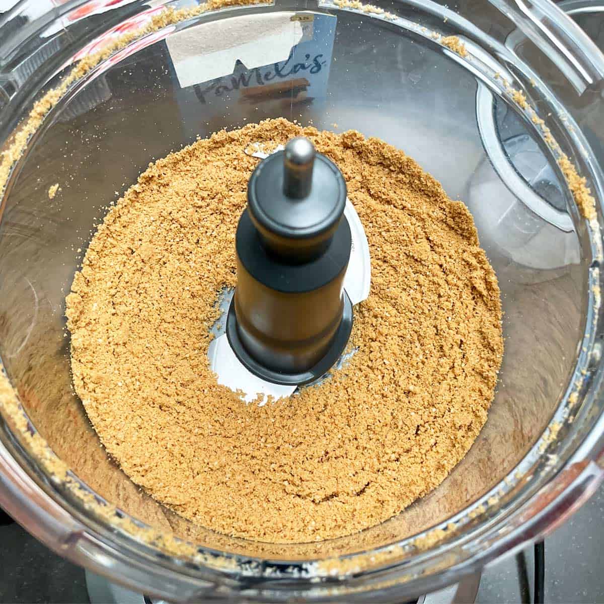 Finely pulsed almonds and graham cracker in a food processer.