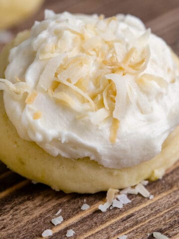 Key lime cookies with coconut buttercream frosting and toasted coconut on top.