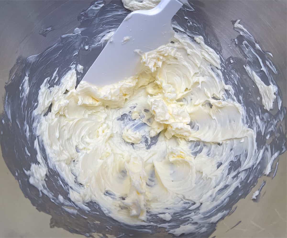 Whipping butter in a mixer bowl.