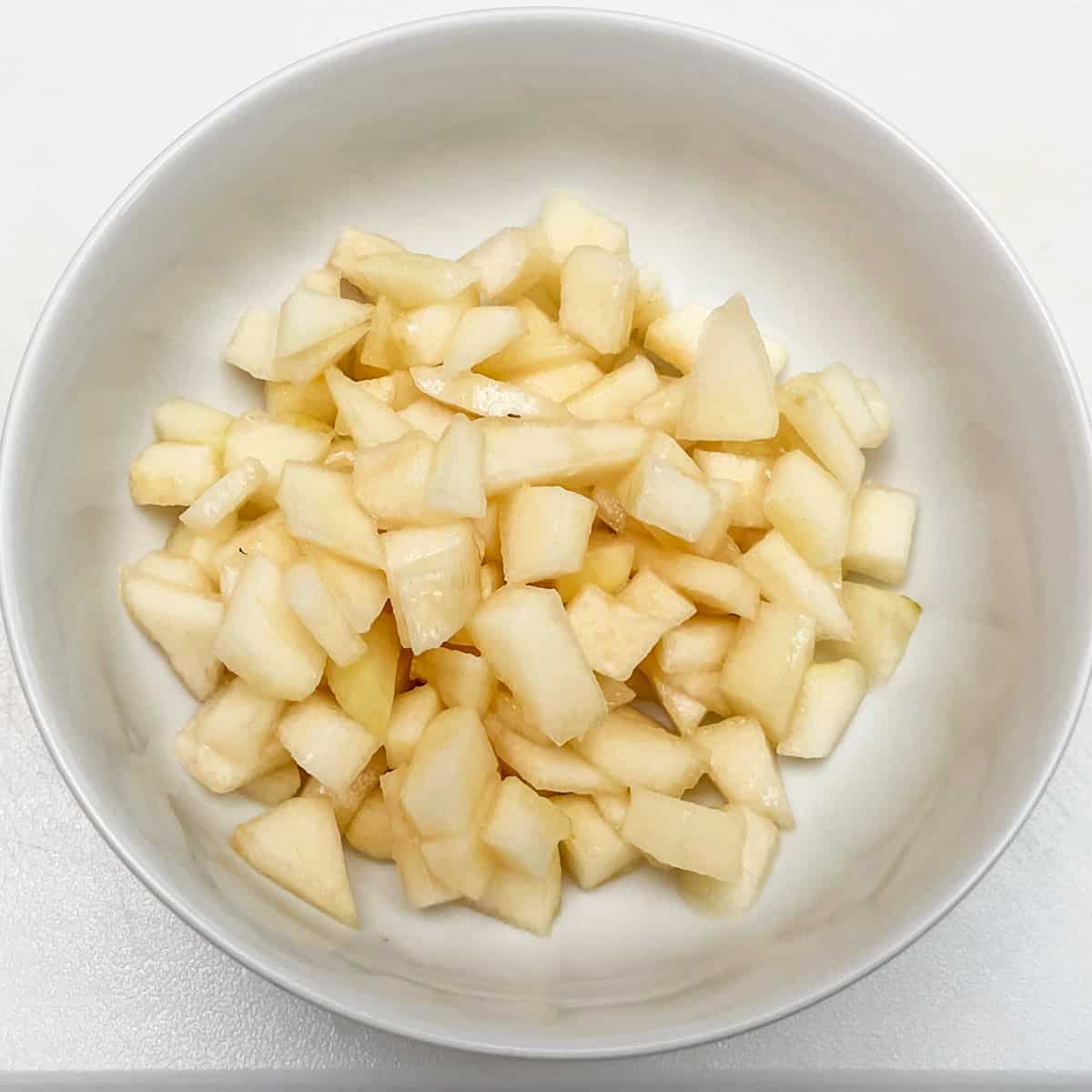 Diced pears in a bowl.