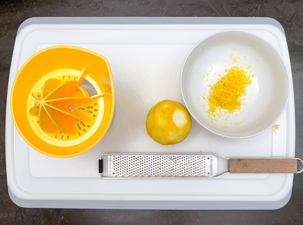 Tools for juicing and zesting a lemon.