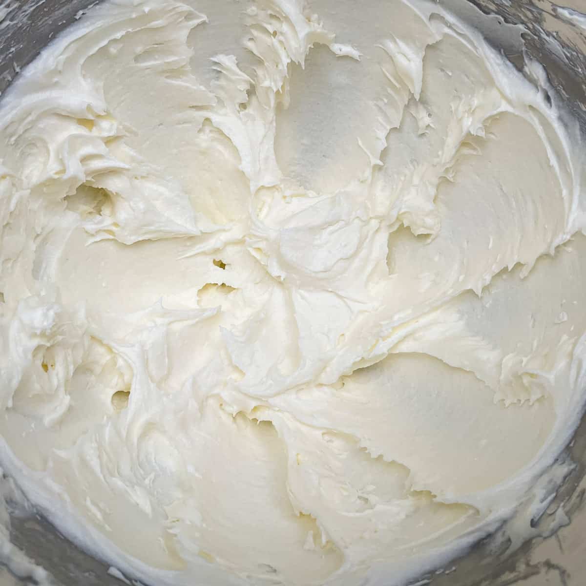 How silky smooth cream cheese and butter looks after adding the sugar and mixing for 3 minutes.
