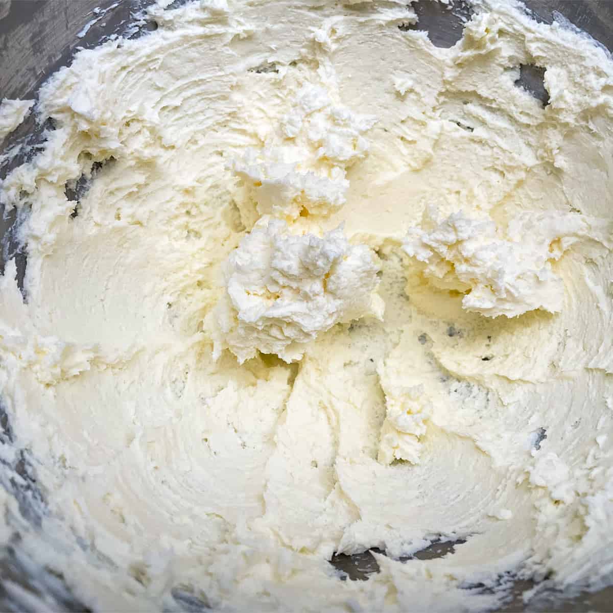 How cream cheese and butter looks kinda lumpy after mixing for 2 to 3 minutes.
