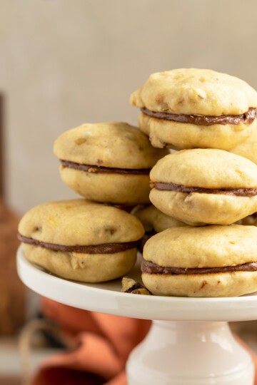 Chocolate banana bread cookies on a pedestaled for feature picture.