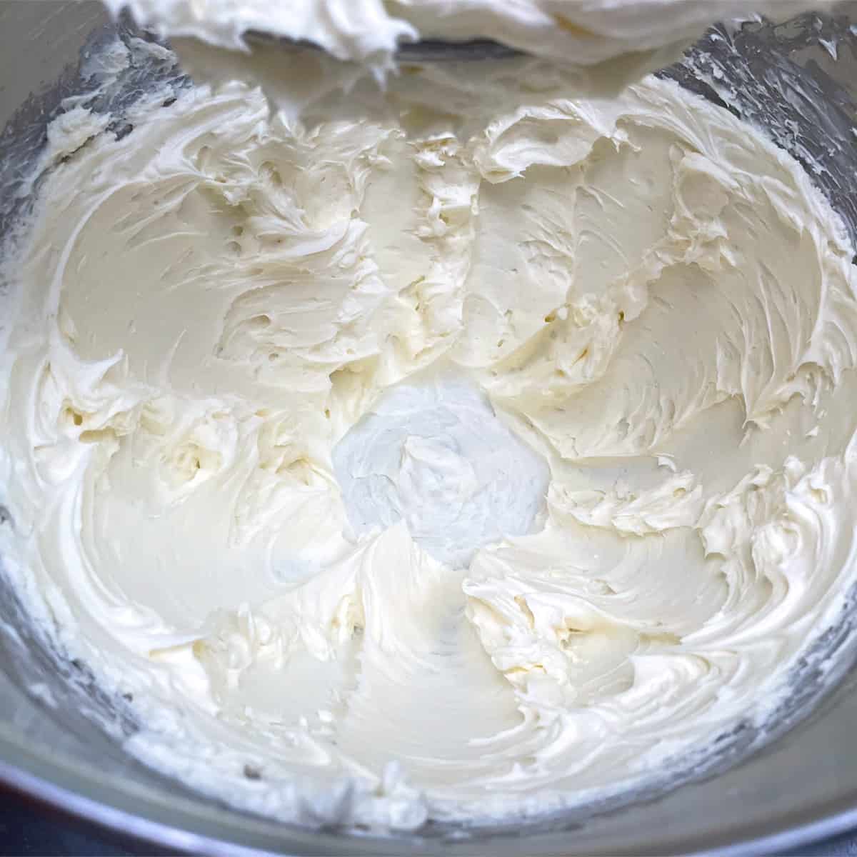 Cream cheese and sugar softly whipped to start the mixing of the cheesecake.