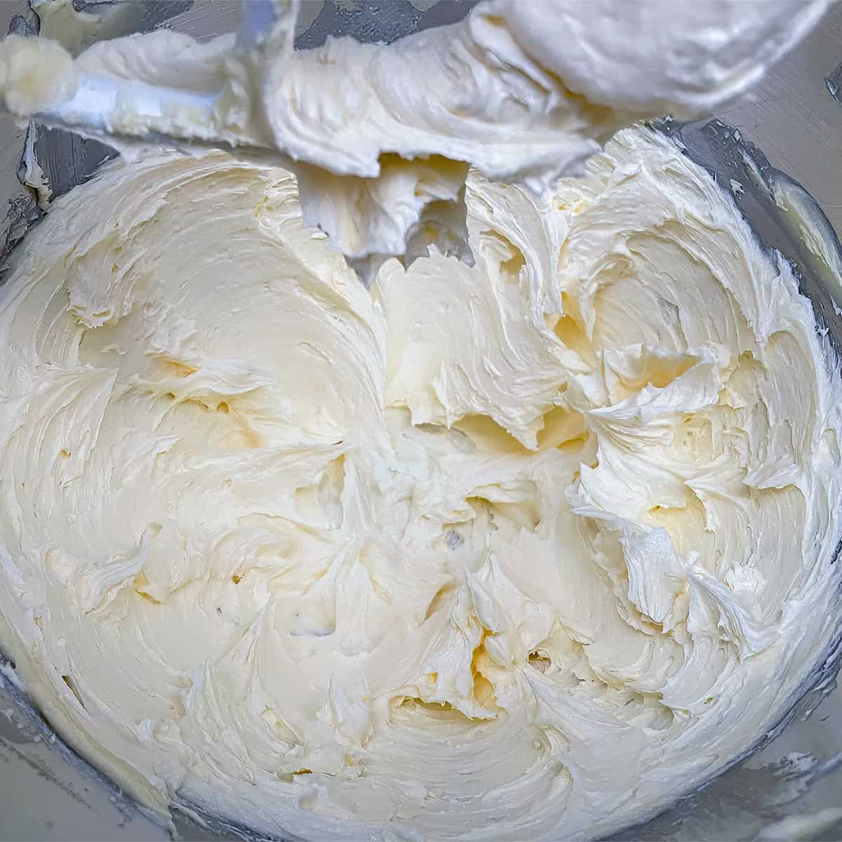 Creamed butter, caster sugar soft whipped in mixer bowl.