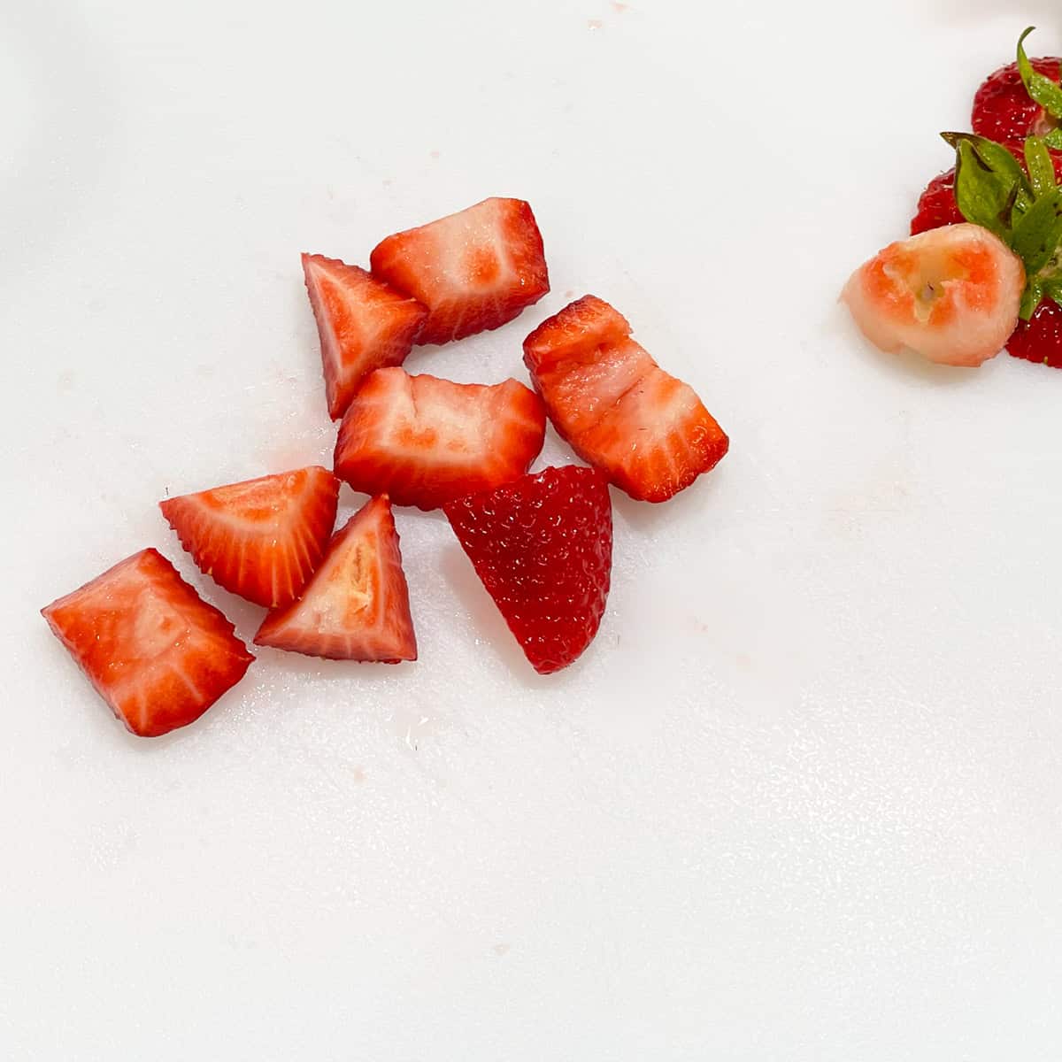 Strawberries are cut up into eight pieces.