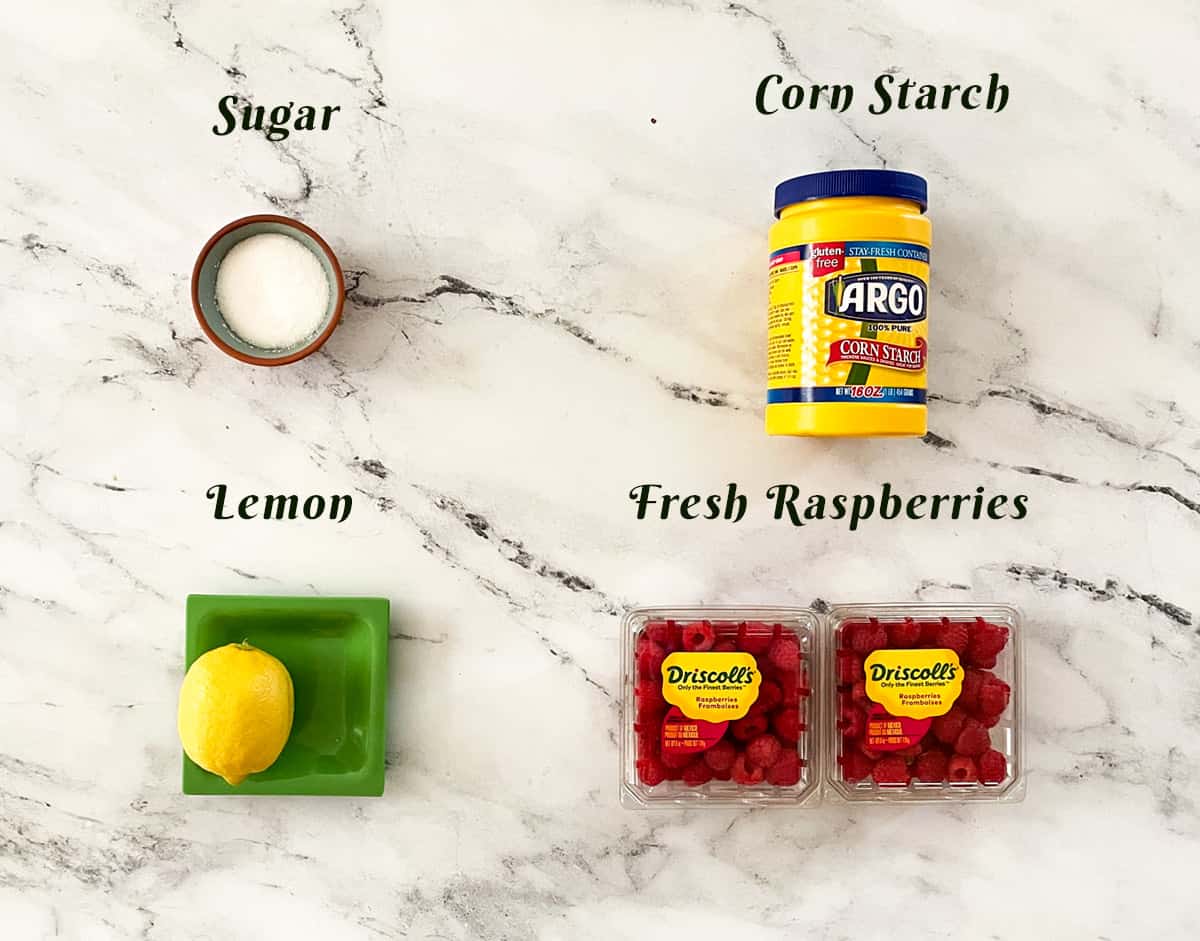 Ingredients for making raspberry jam.