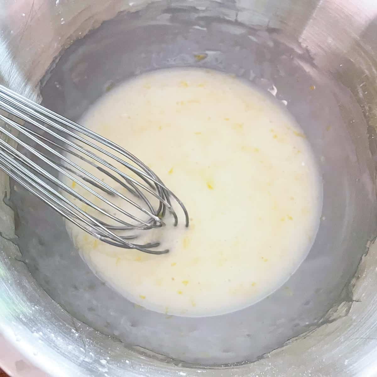 Lemon glaze mixed and ready to be added to the tops of each cookie.