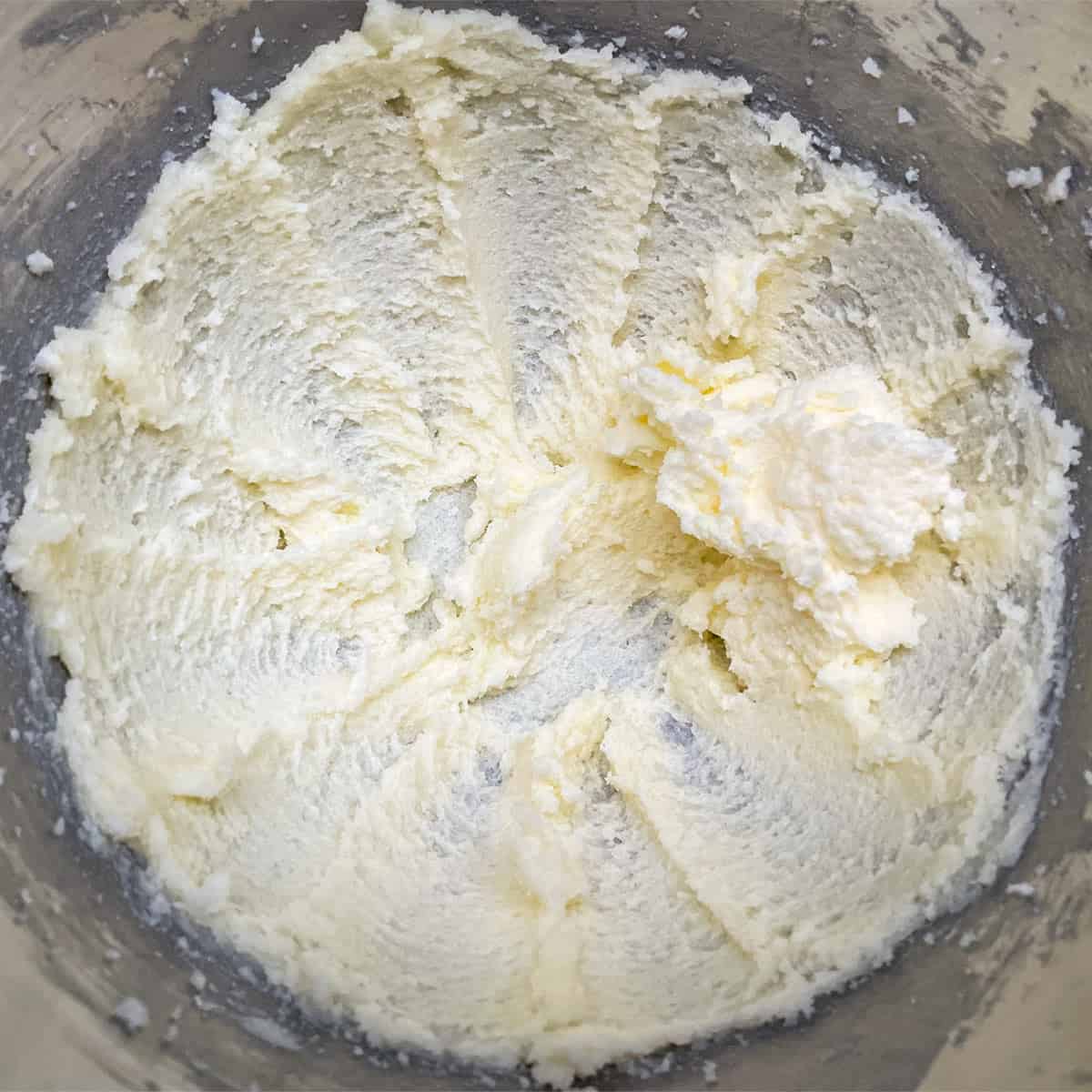 Butter and sugar in a mixer bowl that has been mixed for 3 minutes.