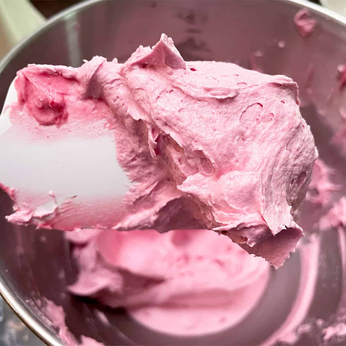 Blackberry buttercream after 6 minutes of mixing.